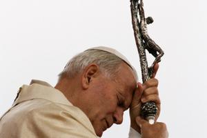 Pope John Paul II prays with his eyes closed while clutching his crosier bearing the crucifix on a visit to Colombia in July 1986. Pope John Paul II prays with his eyes closed while clutching his crosier bearing the crucifix on a visit to Colombia in July 1986.