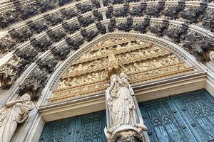 Crescent moon Madonna above the left main entrance of Cologne Cathedral. Crescent moon Madonna above the left main entrance of Cologne Cathedral.