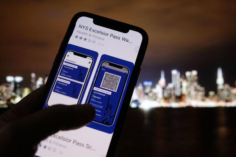A debate has ensued over ‘vaccine passports.’ This illustration photo taken in Los Angeles on April 6 shows a person looking at the app for the New York State Excelsior Pass, which provides secure, digital proof of a COVID-19 vaccination, in front of a screen showing the New York skyline. As the United States' vaccination campaign accelerates, so-called vaccine passports are gaining traction despite political divisions and privacy and freedom concerns. A debate has ensued over ‘vaccine passports.’ This illustration photo taken in Los Angeles on April 6 shows a person looking at the app for the New York State Excelsior Pass, which provides secure, digital proof of a COVID-19 vaccination, in front of a screen showing the New York skyline. As the United States' vaccination campaign accelerates, so-called vaccine passports are gaining traction despite political divisions and privacy and freedom concerns.