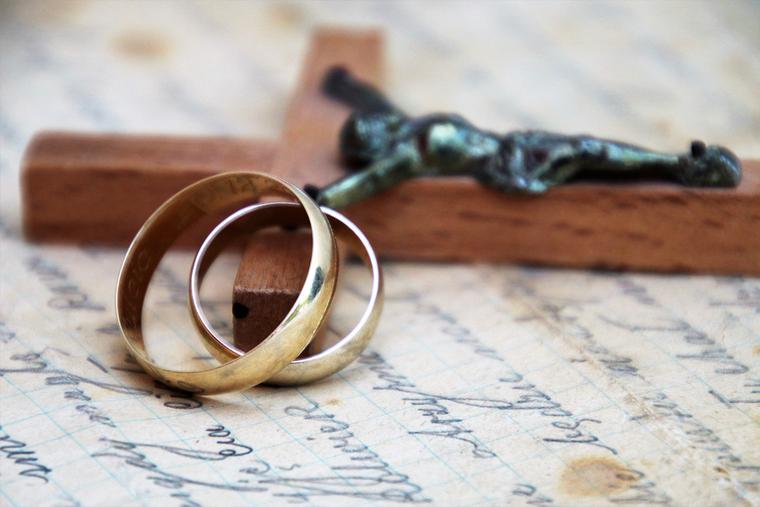 Wedding rings and crucifix Wedding rings and crucifix