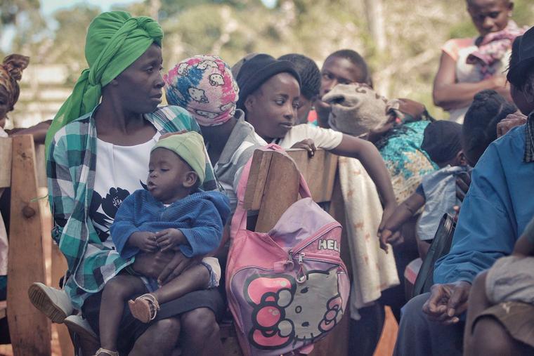 Families sit together in Port-au-Prince. Families sit together in Port-au-Prince.