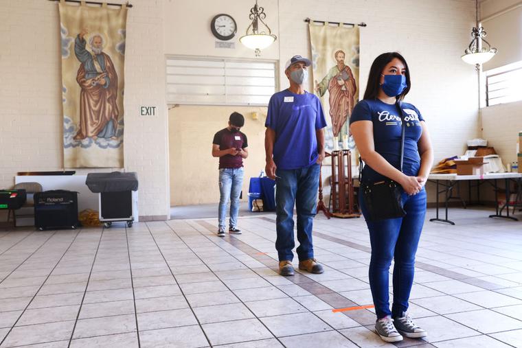 People wait to receive their first dose of the Pfizer COVID-19 vaccine at a clinic targeting minority community members at St. Patrick's Catholic Church on April 9, 2021 in Los Angeles, California. People wait to receive their first dose of the Pfizer COVID-19 vaccine at a clinic targeting minority community members at St. Patrick's Catholic Church on April 9, 2021 in Los Angeles, California.