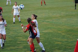 High school girls play a soccer game. High school girls play a soccer game.