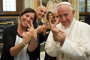 Pope Francis uses sign language with participants of the Jubilee for the sick and disabled in the Pope Paul VI Hall on June 10, 2016. Pope Francis uses sign language with participants of the Jubilee for the sick and disabled in the Pope Paul VI Hall on June 10, 2016.