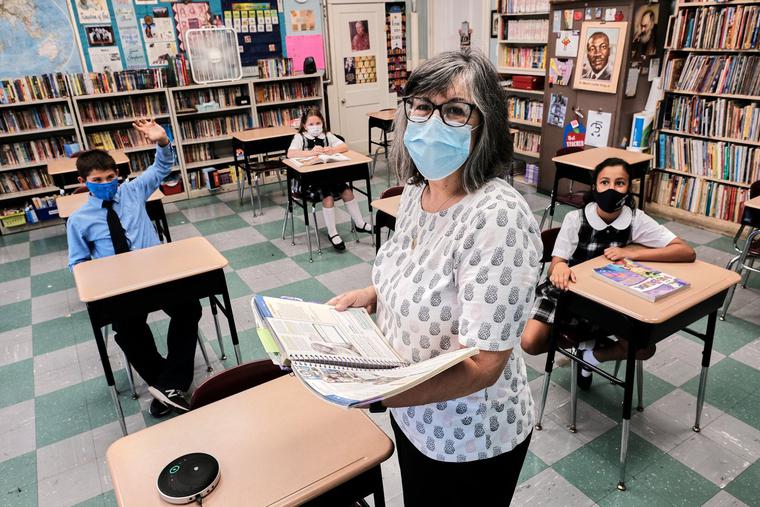 Ms. Sharon Rozzi instructs 5th grade students at East Boston Central Catholic school amid the COVID pandemic within the Archdiocese of Boston. Ms. Sharon Rozzi instructs 5th grade students at East Boston Central Catholic school amid the COVID pandemic within the Archdiocese of Boston.