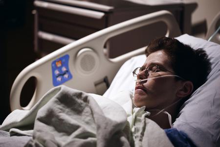 A patient declared brain dead sleeps in a hospital bed. A patient declared brain dead sleeps in a hospital bed.