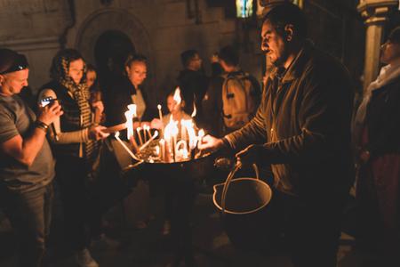 The faithful light candles in the Church of the Holy Sepulcher in Jerusalem. Prayer and action are needed in response to global religious persecution. The faithful light candles in the Church of the Holy Sepulcher in Jerusalem. Prayer and action are needed in response to global religious persecution.