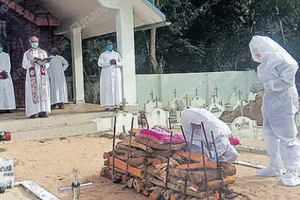 A funeral service during the height of the coronavirus pandemic in Kerala. A funeral service during the height of the coronavirus pandemic in Kerala.