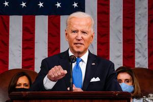 US President Joe Biden, flanked by US Vice President Kamala Harris (L) and Speaker of the House of Representatives Nancy Pelosi (R), addresses a joint session of Congress at the US Capitol in Washington, DC, on April 28, 2021. US President Joe Biden, flanked by US Vice President Kamala Harris (L) and Speaker of the House of Representatives Nancy Pelosi (R), addresses a joint session of Congress at the US Capitol in Washington, DC, on April 28, 2021.