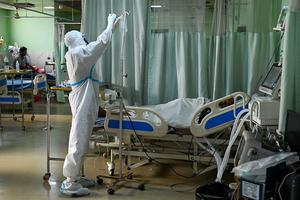 A health worker wearing a personal protective equipment (PPE) suit attends to a COVID-19 coronavirus patient inside the Intensive Care Unit of the Teerthanker Mahaveer University hospital in Moradabad on May 5. A health worker wearing a personal protective equipment (PPE) suit attends to a COVID-19 coronavirus patient inside the Intensive Care Unit of the Teerthanker Mahaveer University hospital in Moradabad on May 5.