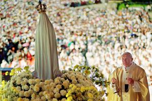 Pope John Paul II celebrates a mass May 12, 1991 in the Chapel of the Apparition in front of the statue of Virgin of Fatima in Fatima where about a million believers attended the Procession of Candles. In 1997, the pope dedicated a shrine in a Polish church to the Virgin of Fatima, thanking her for intervening to save him from an assassination attempt in 1981. Pope John Paul II celebrates a mass May 12, 1991 in the Chapel of the Apparition in front of the statue of Virgin of Fatima in Fatima where about a million believers attended the Procession of Candles. In 1997, the pope dedicated a shrine in a Polish church to the Virgin of Fatima, thanking her for intervening to save him from an assassination attempt in 1981.
