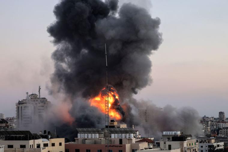 Black smoke billows after an Israeli airstrike on Gaza City targeted the Ansar compound, linked to the Hamas movement, in the Gaza Strip on May 14. Israel targeted Gaza and deployed extra troops to the border as Palestinians fired barrages of rockets back, with the death toll in the enclave on the fourth day of conflict climbing to more than 100. Black smoke billows after an Israeli airstrike on Gaza City targeted the Ansar compound, linked to the Hamas movement, in the Gaza Strip on May 14. Israel targeted Gaza and deployed extra troops to the border as Palestinians fired barrages of rockets back, with the death toll in the enclave on the fourth day of conflict climbing to more than 100.