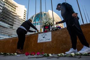 HERO Tent President Kiana Simmons (L), and Amar Singh of San Jose (R), tend to a vigil organized by HERO Tent, following the mass shooting at the Valley Transportation Authority (VTA) light-rail yard, outside City Hall on May 26, 2021 in San Jose, California. HERO Tent President Kiana Simmons (L), and Amar Singh of San Jose (R), tend to a vigil organized by HERO Tent, following the mass shooting at the Valley Transportation Authority (VTA) light-rail yard, outside City Hall on May 26, 2021 in San Jose, California.