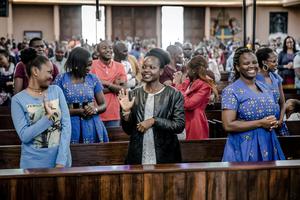 Catholics exchange the sign of peace without shaking hands during a Sunday Mass at Holy Family Minor Basilica in Nairobi, Kenya, on March 22, 2020. Catholics exchange the sign of peace without shaking hands during a Sunday Mass at Holy Family Minor Basilica in Nairobi, Kenya, on March 22, 2020.