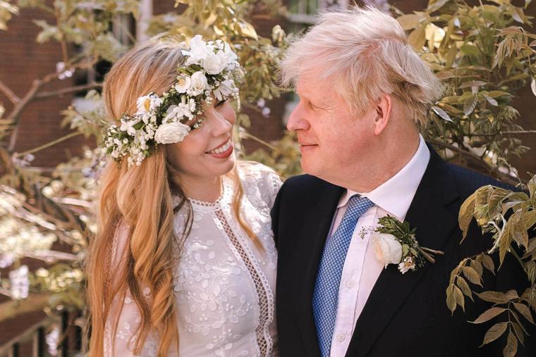Prime Minister Boris Johnson poses with his wife Carrie Johnson in the garden of 10 Downing Street following their wedding at Westminster Cathedral, May 29, 2021 in London, England. Prime Minister Boris Johnson poses with his wife Carrie Johnson in the garden of 10 Downing Street following their wedding at Westminster Cathedral, May 29, 2021 in London, England.