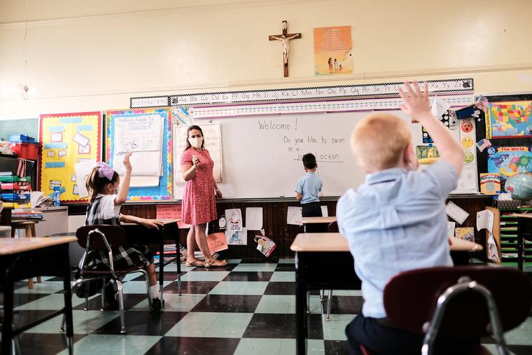 A teacher asks students questions during class at a Boston archdiocese school amid the coronavirus pandemic. A teacher asks students questions during class at a Boston archdiocese school amid the coronavirus pandemic.