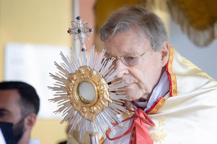 Cardinal George Pell holds the monstrance with the Blessed Sacrament during the annual Eucharistic procession at the Angelicum in Rome on May 13. Cardinal George Pell holds the monstrance with the Blessed Sacrament during the annual Eucharistic procession at the Angelicum in Rome on May 13.