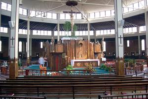 Interior of the Coliseum at the National Shrine of the North American Martyrs in Auriesville, New York, showing the sanctuary and high altar. Interior of the Coliseum at the National Shrine of the North American Martyrs in Auriesville, New York, showing the sanctuary and high altar.