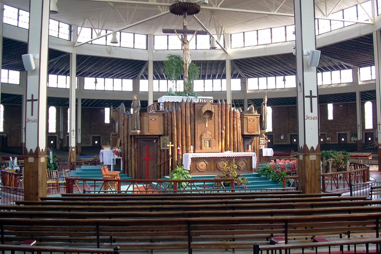 Interior of the Coliseum at the National Shrine of the North American Martyrs in Auriesville, New York, showing the sanctuary and high altar. Interior of the Coliseum at the National Shrine of the North American Martyrs in Auriesville, New York, showing the sanctuary and high altar.