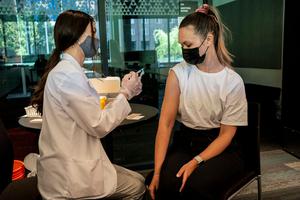 A student receives a COVID-19 vaccine at a vaccination clinic on the University of Washington campus on May 18 in Seattle. A student receives a COVID-19 vaccine at a vaccination clinic on the University of Washington campus on May 18 in Seattle.