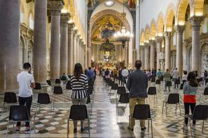 Catholics attend Mass amid the COVID pandemic. Catholics attend Mass amid the COVID pandemic.