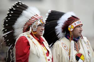 Two Native Americans faithful wearing traditional regalia stand during Pope Francis weekly general audience in St Peter's square at the Vatican on April 27, 2016. Two Native Americans faithful wearing traditional regalia stand during Pope Francis weekly general audience in St Peter's square at the Vatican on April 27, 2016.