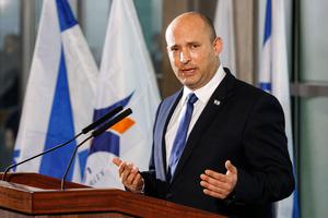 New Israeli Prime Minister Naftali Bennett addresses reporters at Ben Gurion International Airport on June 22. New Israeli Prime Minister Naftali Bennett addresses reporters at Ben Gurion International Airport on June 22.