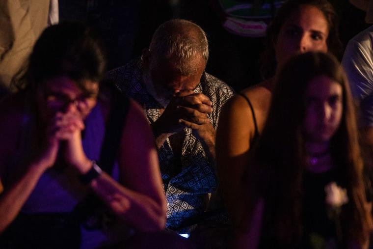People pray during a community vigil on the beach for those missing after the collapse of the Champlain Towers South condominium building in Surfside, Florida, June 28. Catholic parishes are also holding prayer vigils. People pray during a community vigil on the beach for those missing after the collapse of the Champlain Towers South condominium building in Surfside, Florida, June 28. Catholic parishes are also holding prayer vigils.