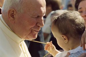 Pope John Paul II embracing a child on September 16, 1998. Pope John Paul II embracing a child on September 16, 1998.