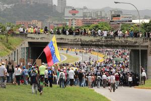 Protesters closed a highway in Caracas while participating in the event called The mother of all protests in Venezuela against Nicolas Maduro government in 2017.