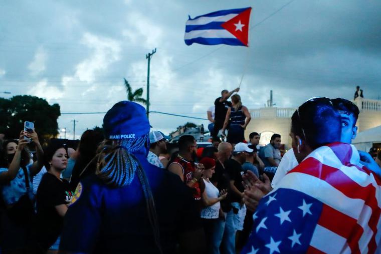 With some holding and waving Cuban and U.S. flags, demonstrators protest against the Cuban government July 11 in Miami. Thousands of Cubans across the island-nation took part in rare protests against the communist government, marching through several towns chanting, 'Down with the dictatorship,' and 'We want liberty.' With some holding and waving Cuban and U.S. flags, demonstrators protest against the Cuban government July 11 in Miami. Thousands of Cubans across the island-nation took part in rare protests against the communist government, marching through several towns chanting, 'Down with the dictatorship,' and 'We want liberty.'