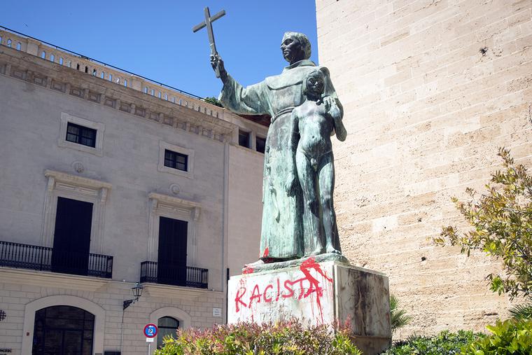 A statue of St. Junípero Serra is pictured June 22 in Palma de Mallorca, Spain, after it was sprayed with graffiti reading "Racist." A statue of St. Junípero Serra is pictured June 22 in Palma de Mallorca, Spain, after it was sprayed with graffiti reading "Racist."