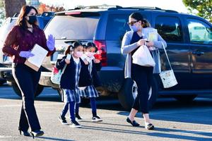 Students arrive at St. Joseph Catholic School in La Puente, California, on Nov. 16, 2020. Students arrive at St. Joseph Catholic School in La Puente, California, on Nov. 16, 2020.