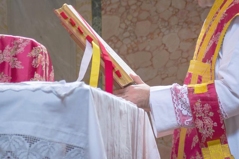 A priest celebrates the Latin Mass. A priest celebrates the Latin Mass.