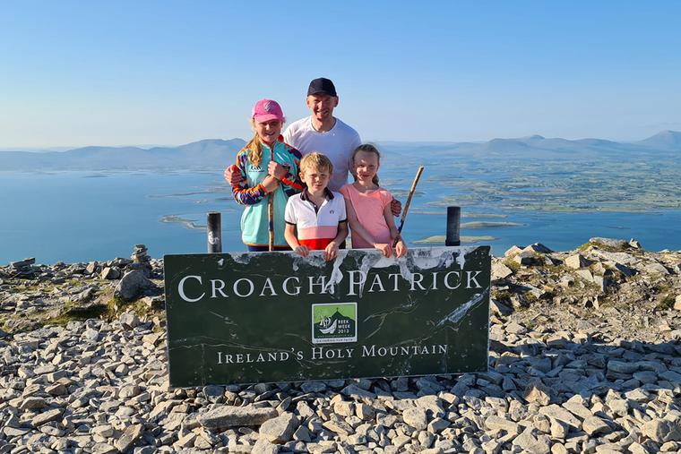 Nial McSorly and his children at the summit of The Reek in July 2021. Nial McSorly and his children at the summit of The Reek in July 2021.