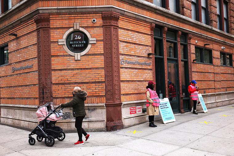 A woman pushes a stroller past the Planned Parenthood in the Financial District neighborhood of Manhattan on April 16. A woman pushes a stroller past the Planned Parenthood in the Financial District neighborhood of Manhattan on April 16.