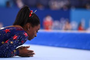 Gymnast Simone Biles prepares to compete in the floor event of the artistic gymnastic women's qualification during the Tokyo 2020 Olympic Games on July 25. Biles withdrew from Olympics all-around gymnastics on July 28. Gymnast Simone Biles prepares to compete in the floor event of the artistic gymnastic women's qualification during the Tokyo 2020 Olympic Games on July 25. Biles withdrew from Olympics all-around gymnastics on July 28.