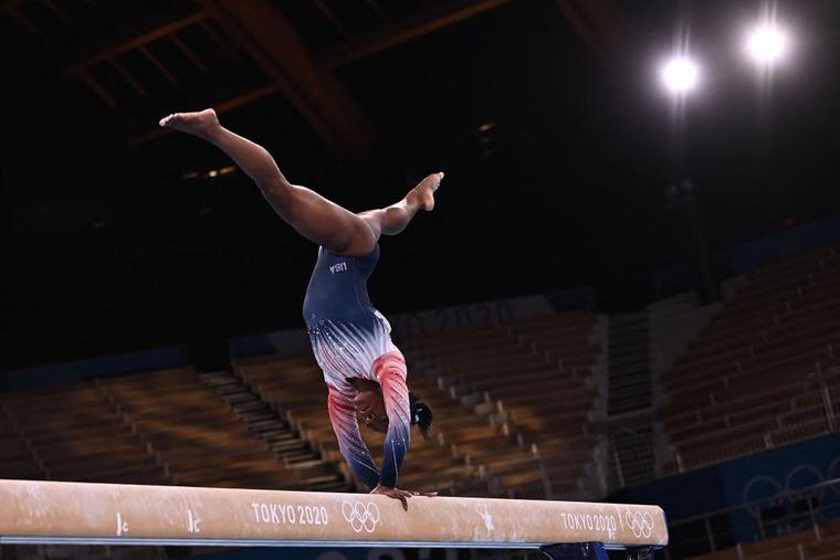 USA's Simone Biles competes in the artistic gymnastics women's balance beam final of the Tokyo 2020 Olympic Games at Ariake Gymnastics Centre in Tokyo on August 3, 2021. USA's Simone Biles competes in the artistic gymnastics women's balance beam final of the Tokyo 2020 Olympic Games at Ariake Gymnastics Centre in Tokyo on August 3, 2021.
