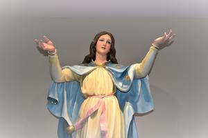 A statue depicts the Assumption. A statue depicts the Assumption.