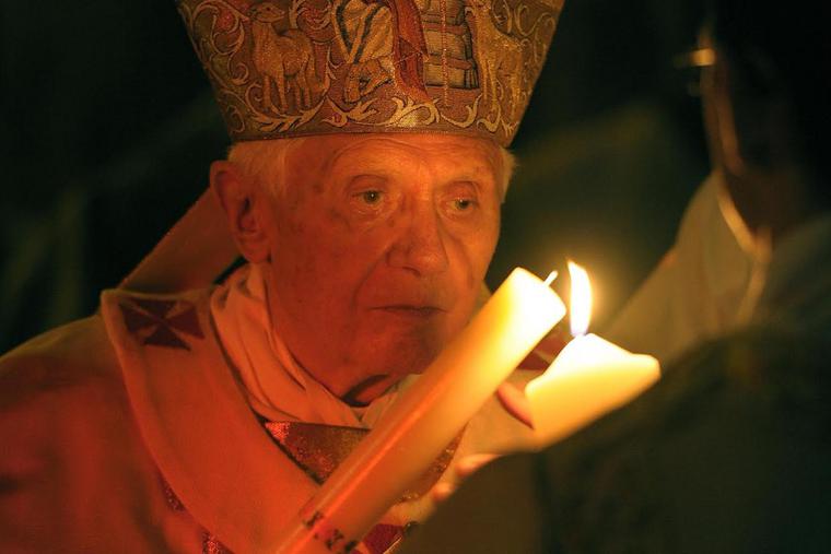 Pope Emeritus Benedict XVI lighting the Pascal Candle at the Easter Vigil Mass in St. Peter's Basilica on Saturday, April 7, 2012. Pope Emeritus Benedict XVI lighting the Pascal Candle at the Easter Vigil Mass in St. Peter's Basilica on Saturday, April 7, 2012.