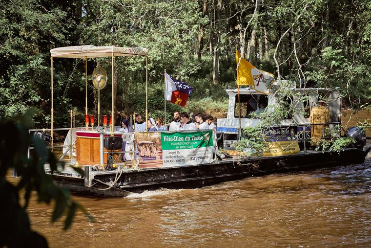 A floating ‘church’ carries Jesus in the Blessed Sacrament down the Bayou Teche. A floating ‘church’ carries Jesus in the Blessed Sacrament down the Bayou Teche.