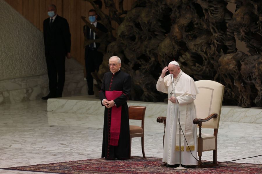 Pope Francis makes the sign of the cross during his general audience on Aug. 11, 2021. Pope Francis makes the sign of the cross during his general audience on Aug. 11, 2021.