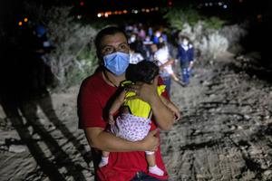 Immigrants walk towards a U.S. Border Patrol checkpoint after they crossed the Rio Grande from Mexico on August 14, 2021 in Roma, Texas. Immigrants walk towards a U.S. Border Patrol checkpoint after they crossed the Rio Grande from Mexico on August 14, 2021 in Roma, Texas.