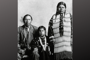 Servant of God Nicholas Black Elk, daughter Lucy Black Elk and wife Anna Brings White, photographed in their home in Manderson, South Dakota, ca 1910. Servant of God Nicholas Black Elk, daughter Lucy Black Elk and wife Anna Brings White, photographed in their home in Manderson, South Dakota, ca 1910.