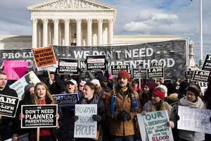 The 44th Annual March for Life, commemorating the anniversary of the 'Roe v. Wade' with the Supreme Court in the background. The 44th Annual March for Life, commemorating the anniversary of the 'Roe v. Wade' with the Supreme Court in the background.