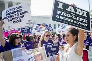 Pro-abortion and pro-life activists demonstrate on the steps of the United States Supreme Court on June 27, 2016, in Washington, DC. Pro-abortion and pro-life activists demonstrate on the steps of the United States Supreme Court on June 27, 2016, in Washington, DC.