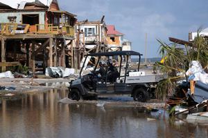 A search and rescue team drives through standing water while checking homes destroyed in the wake of Hurricane Ida on September 2, 2021 in Grand Isle, Louisiana. A search and rescue team drives through standing water while checking homes destroyed in the wake of Hurricane Ida on September 2, 2021 in Grand Isle, Louisiana.