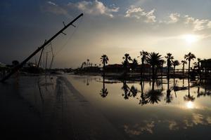 A road is partially covered in floodwater in the wake of Hurricane Ida on Sept. 3, 2021, in Grand Isle, Louisiana. Ida made landfall as a Category 4 hurricane five days before in Louisiana and brought flooding, wind damage and power outages along the Gulf Coast. A road is partially covered in floodwater in the wake of Hurricane Ida on Sept. 3, 2021, in Grand Isle, Louisiana. Ida made landfall as a Category 4 hurricane five days before in Louisiana and brought flooding, wind damage and power outages along the Gulf Coast.