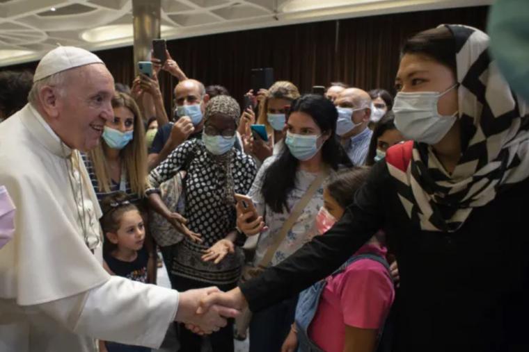 Pope Francis greets people after a documentary screening at the Vatican’s Paul VI Hall on Sept. 6. Pope Francis greets people after a documentary screening at the Vatican’s Paul VI Hall on Sept. 6.