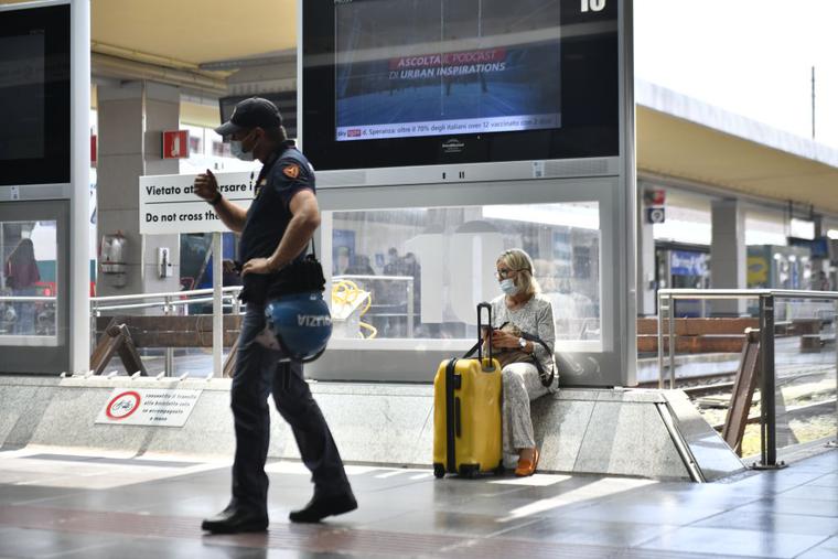 A police officer stands inside Porta Nuova Station on Sept. 1 in Turin, Italy. Italy has imposed a 'Green Pass' for the use of means of transport such as buses, trains, airplanes and ferries as of Sept. 1. A police officer stands inside Porta Nuova Station on Sept. 1 in Turin, Italy. Italy has imposed a 'Green Pass' for the use of means of transport such as buses, trains, airplanes and ferries as of Sept. 1.